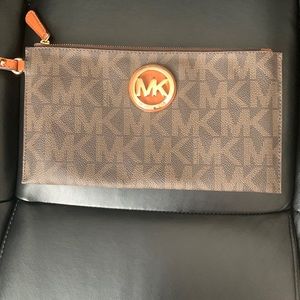 Rarely used Micheal Kors wristlet .